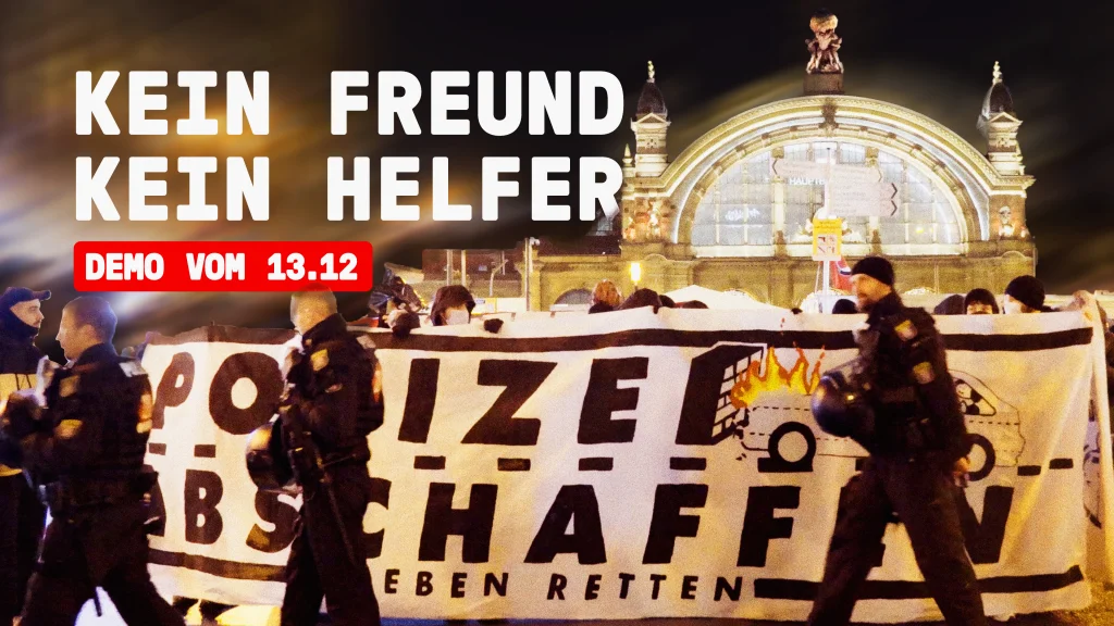 Demonstration vor dem Frankfurter Hauptbahnhof hält ein Transparent auf dem steht 